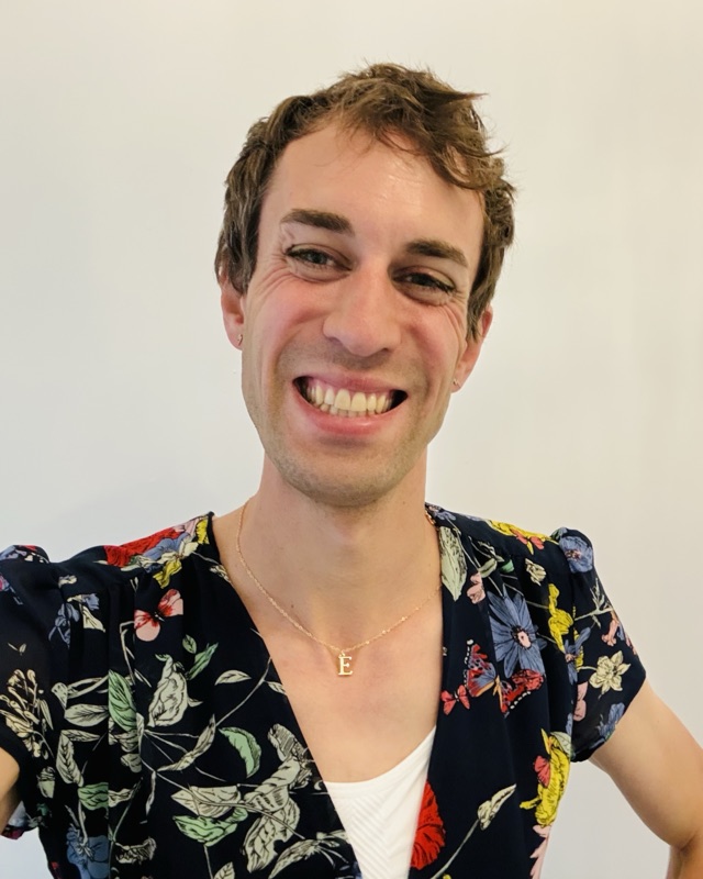 Eve smiling in a floral top