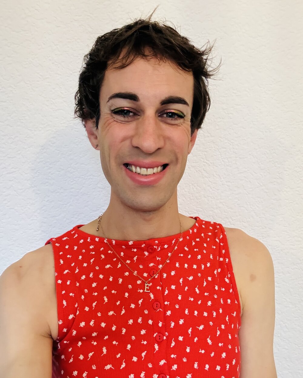 Eve Anderson, founder of Lighthouse Software, smiling in a red dress